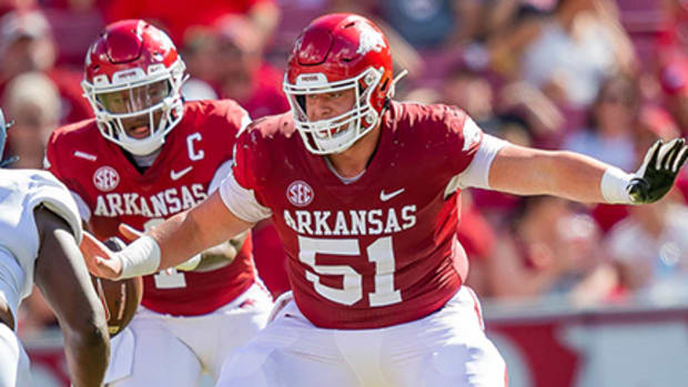 Razorbacks center Ricky Stromberg blocking ahead of quarterback KJ Jefferson in last season's game against Georgia Southern at Razorback Stadium.